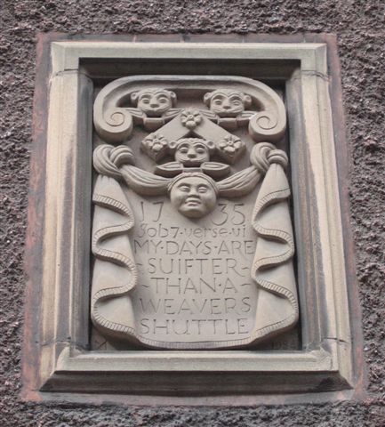 The Webster's plaque on the front of the building
